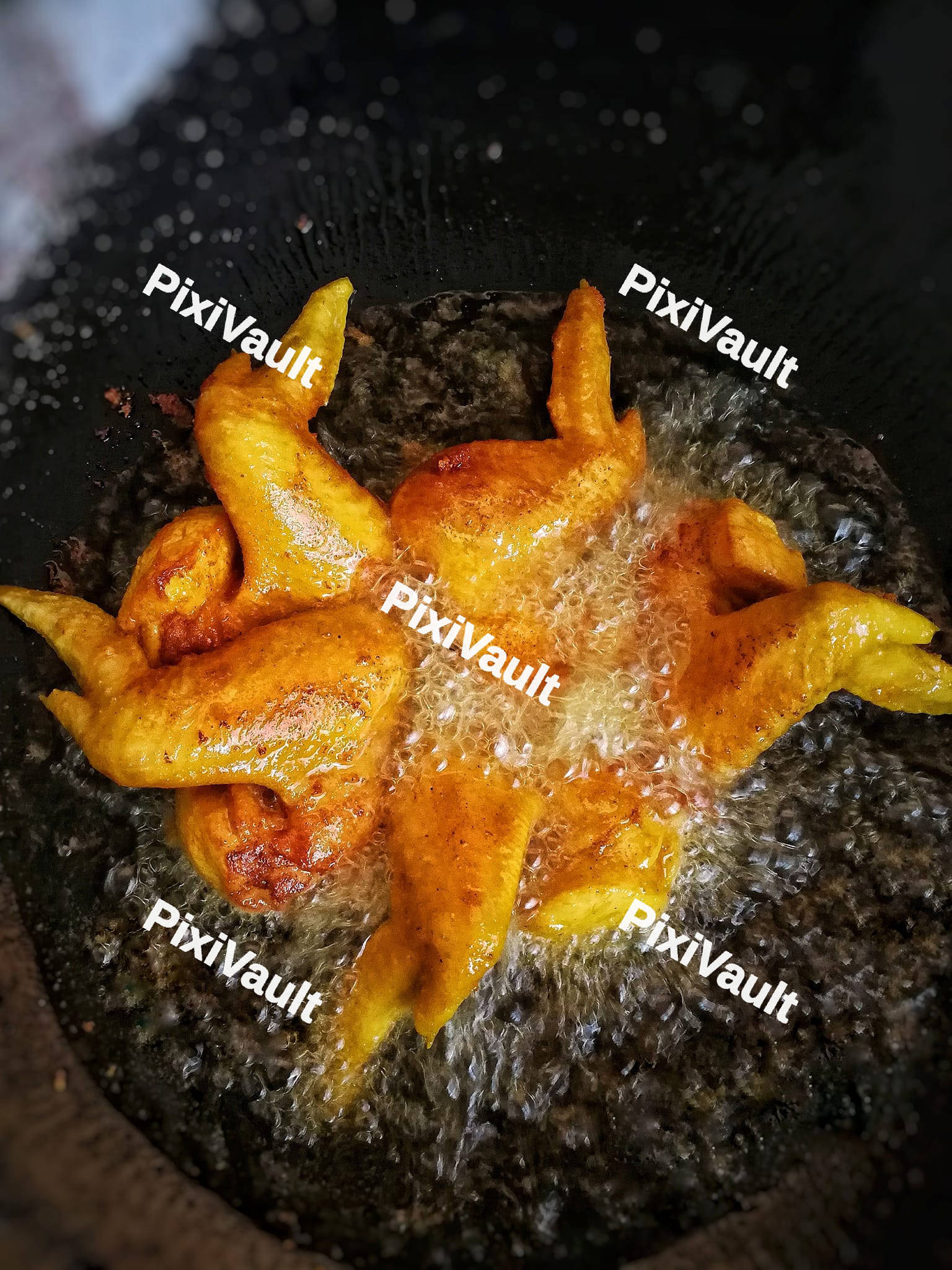 Fried chicken in the boiling oil